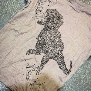 Showcases a striking dinosaur graphic sleeve shirt